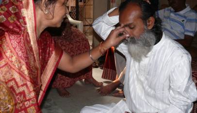 Sister applying tilak on her brother's forehead during the Bhai Dooj ritual