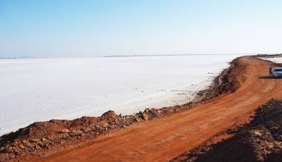 Road running through the white salt desert of the Rann of Kutch near Dholavira